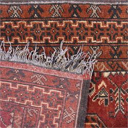 Afghan red ground rug, the field decorated with stylised plant motifs, within multiple borders (137cm x 105cm); together with a Caucasian red ground rug decorated with three Gul motifs (123cm x 85cm)