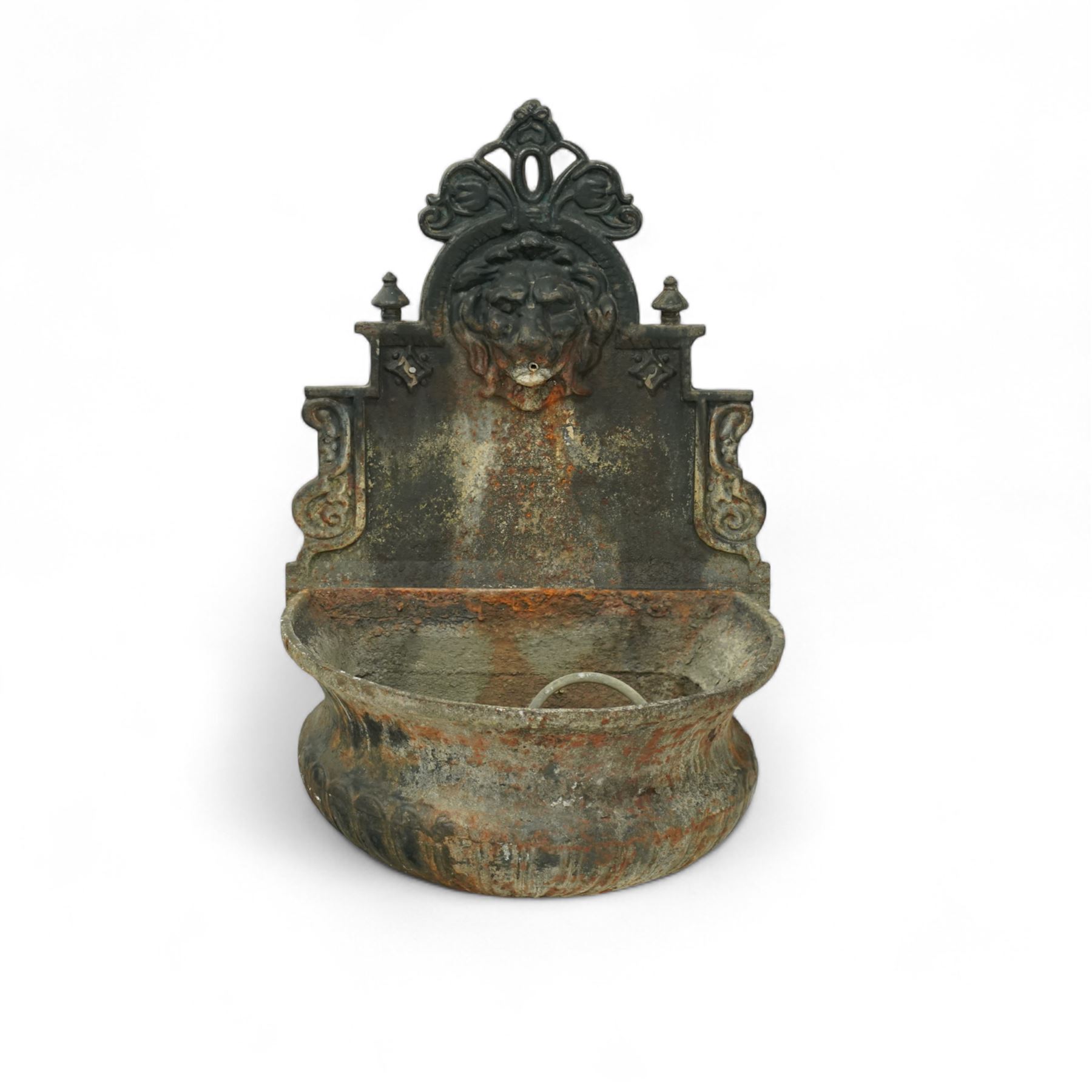 Victorian cast iron ‘lavabo’ lion's head wall fountain, the arched and crested backplate centred with a lion's head spout, with flanking scroll columns and gadrooned basin with flared rim

