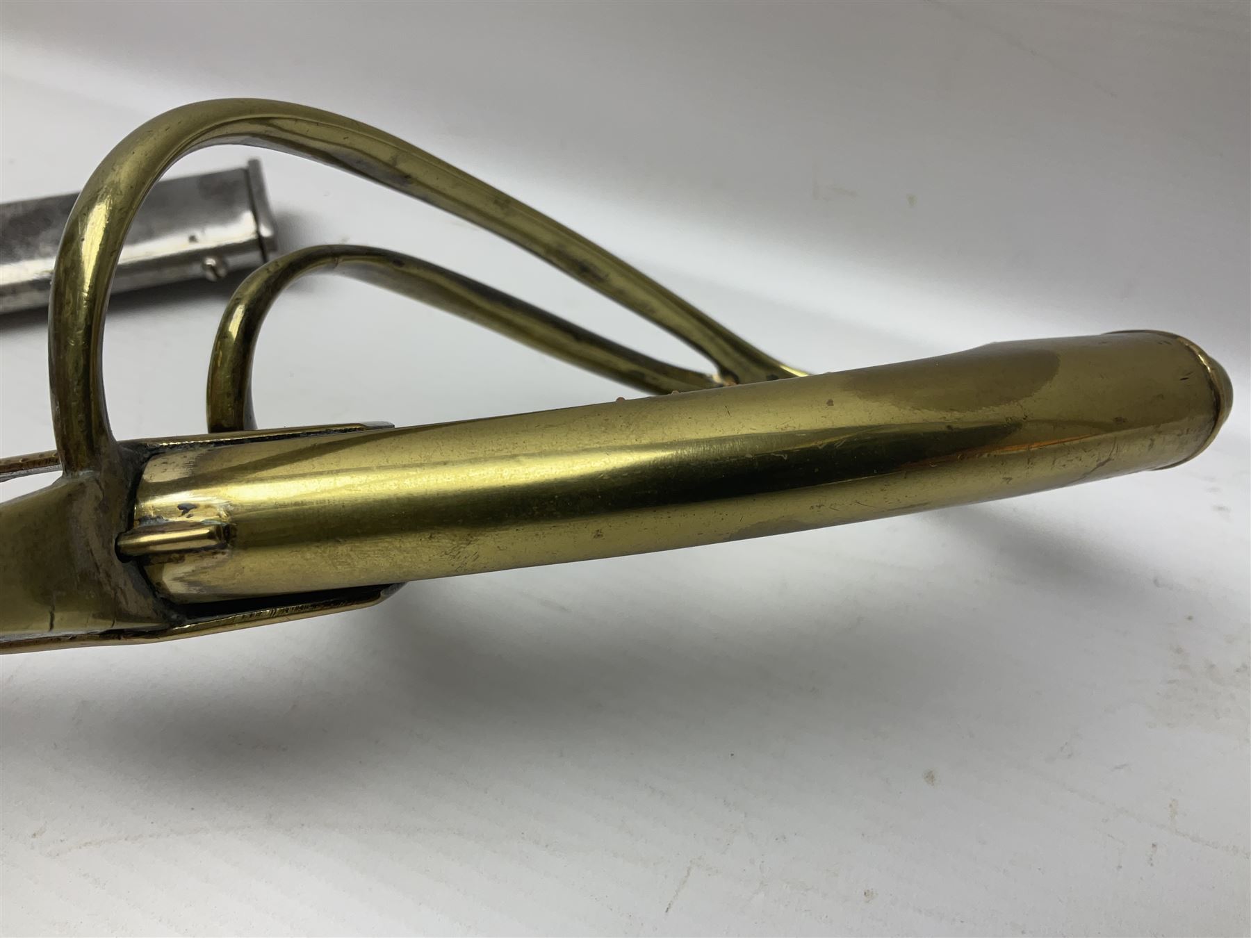 19th century Russian Imperial Navy sword, with 77.5cm curving fullered blade, brass three-bar hilt with lozenge shaped langets and wire-bound leather grip; in polished steel scabbard with one suspension ring L97cm overall