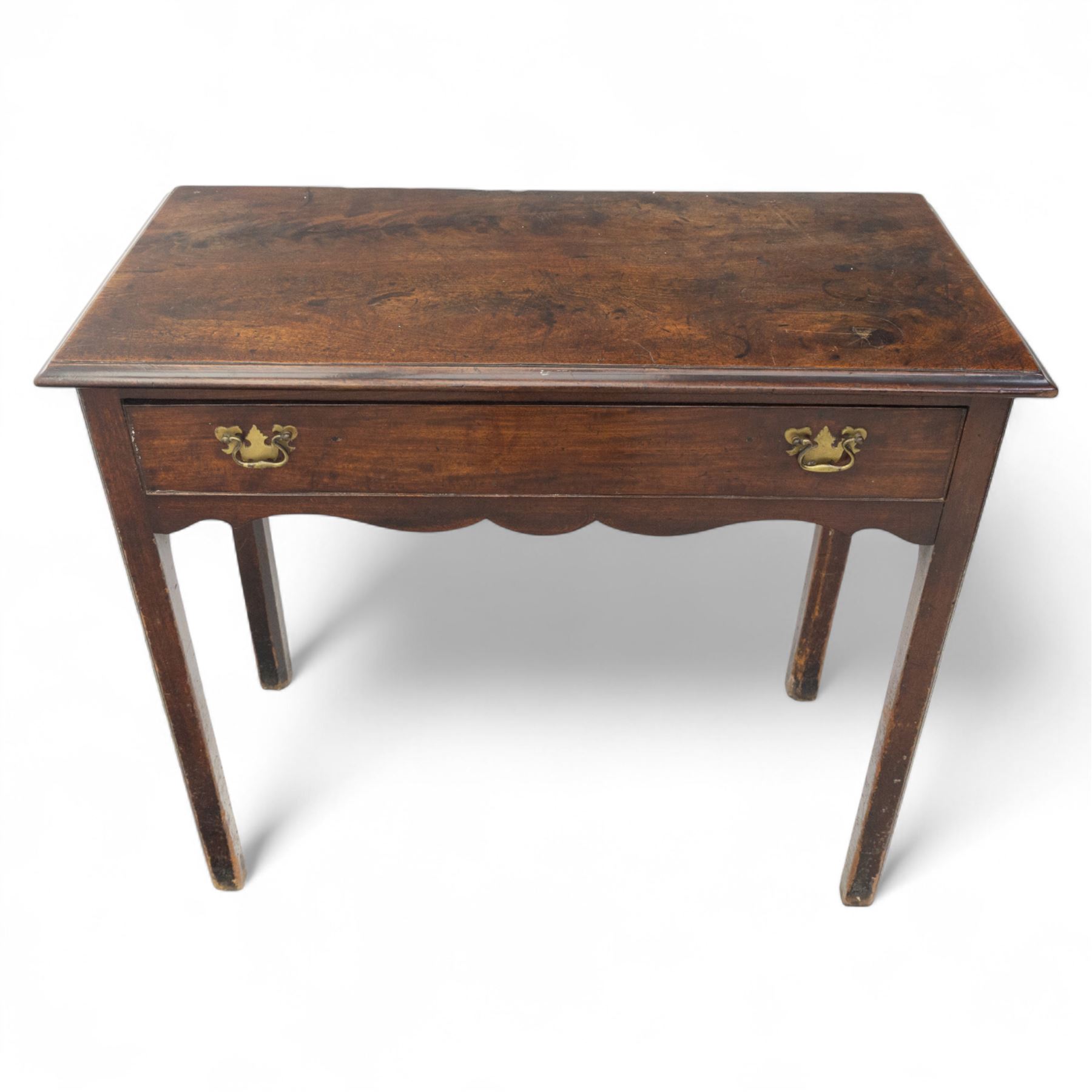 George III mahogany side table, the rectangular moulded top above a single frieze drawer fitted with brass swan neck handles, above a shaped serpentine apron raised upon square section legs, W86 D42 H75cm, together with a George III fretwork mirror, the rectangular plate within a gilt slip surmounted by a pierced crest with inset carved Ho-Ho bird, with shaped apron with gilt shell motif, H84cm W45cm