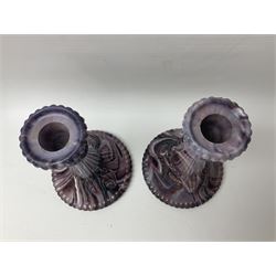 Daum glass two stemmed candle stick signed to verso, together with a pair of slag glass purple candle sticks, Daum H21cm