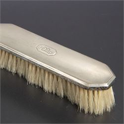 1930s silver mounted three piece dressing table set, comprising hand mirror, hair brush and clothes brush, hallmarked Barker Brothers Silver Ltd, Birmingham 1931