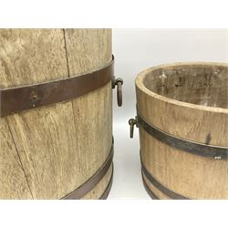 Three coopered buckets, the largest twin ring handles, H33.5 D34.5cm, H22.5cm D25.5cm, H10.5cm D28cm.
