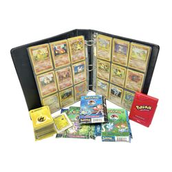 Collection of Pokemon trading cards, mostly 1999 Wizards Pokemon cards to include holo Charizard 4/102, first edition holo Machamp 8/102, further holographic cards; Dark Flareon 35/82 and Dark Vaporeon 45/82, cards from themed sets and 4th edition prints; 1998 Electronic Pokédex with cardboard boxes for themed decks Blackout, Overgrowth and Power Reserve Jungle, along with a large quantity of energy and trainer cards 