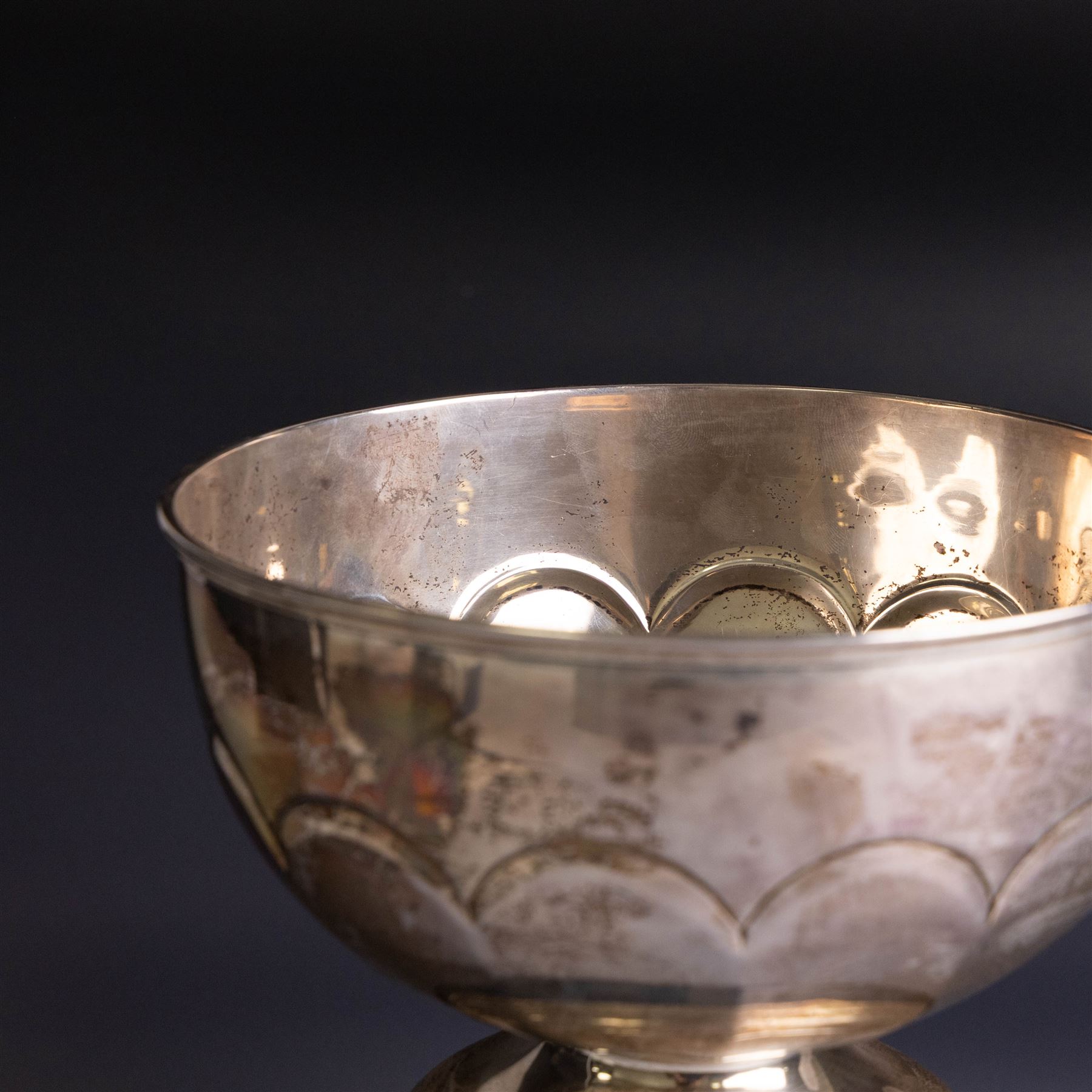 Edwardian silver pedestal bowl, of part fluted circular form, hallmarked Birmingham 1909, maker's marked worn and indistinct, upon an ebonised wooden pedestal, bowl H11.5cm
