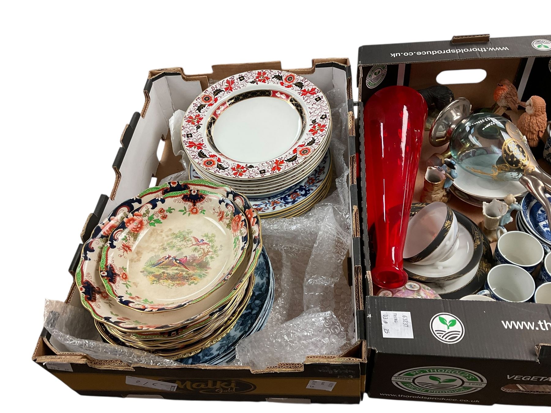 Two Coalport trios, decorated with birds and flowers, together with coloured glass decanters and other collectables, in five boxes 