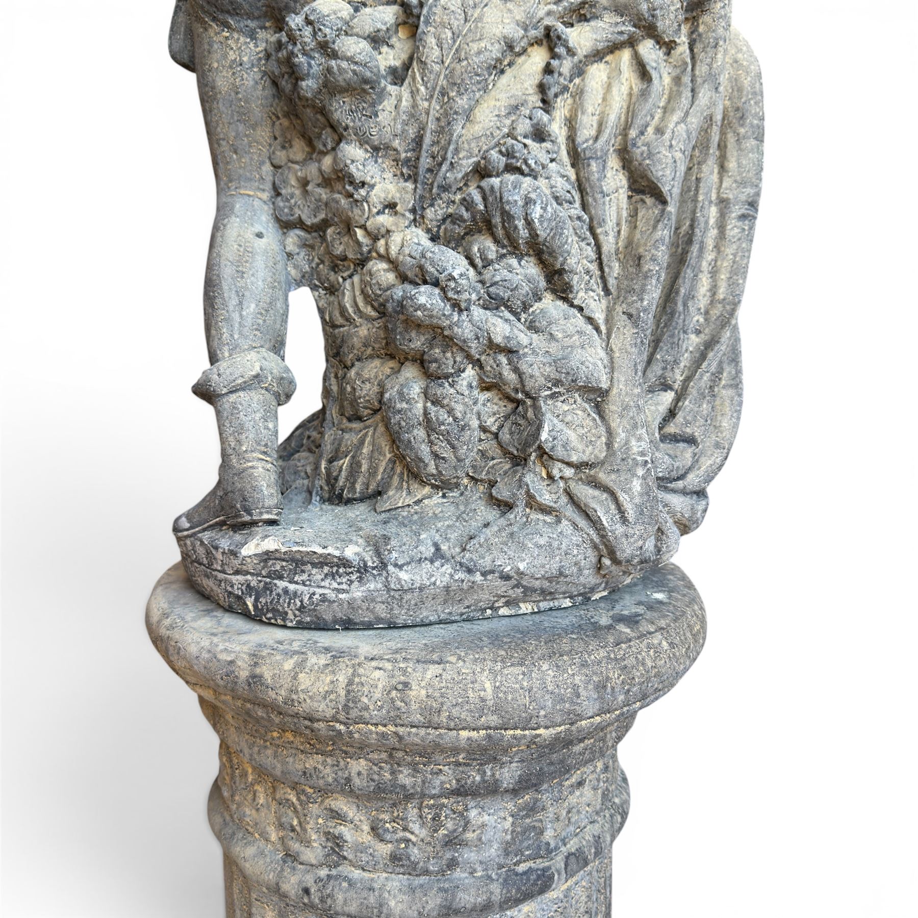 Composite garden statue group of Romeo and Juliet embracing, the couple adorned in Medieval dress standing on a naturalistic base with fallen flowers, raised on a Neoclassical fluted pedestal with Anthemion leaf motifs