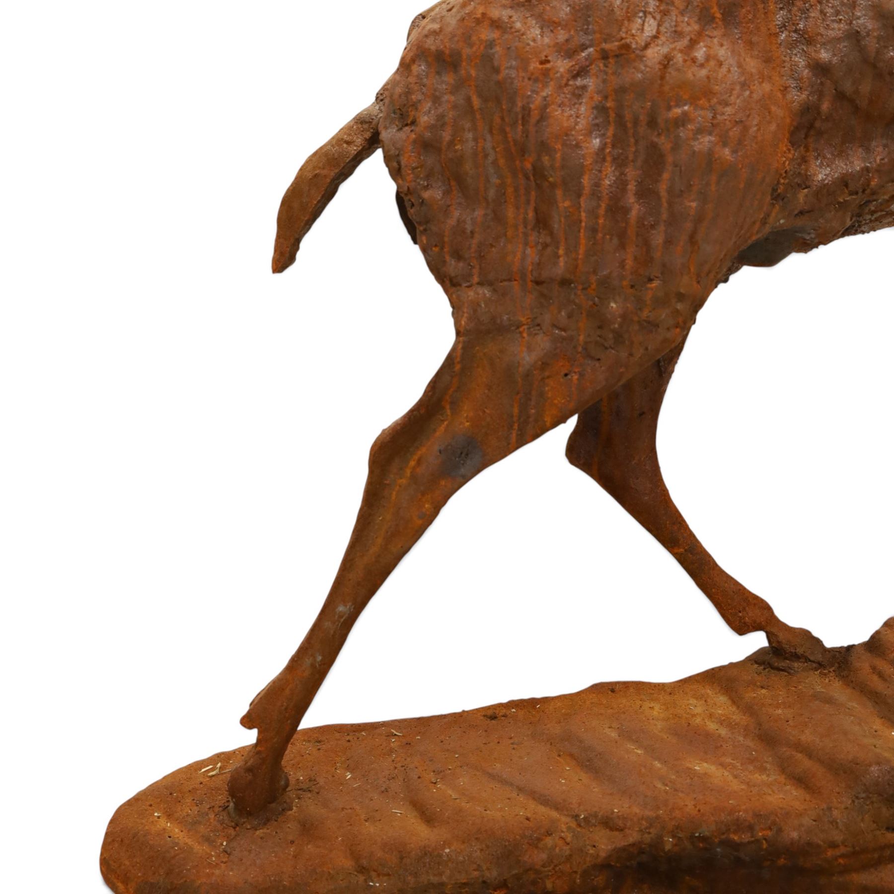 Pair of cast iron stags, upon a on moulded rocky plinth, standing alert 