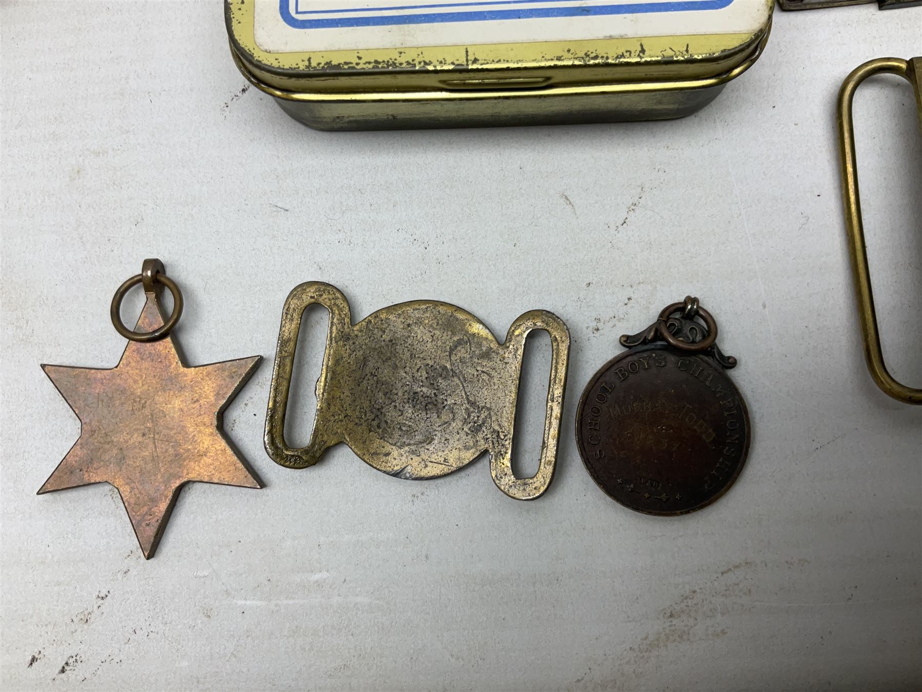 Miscellaneous militaria including two Royal Artillery and one Royal Horse Artillery stable belts; Northamptonshire Regiment trench art brass shell case lighter; unused Matchless Fire-Set; pocket knives and multi-tool; lanyards; oak shield with York & Lancaster crest etc