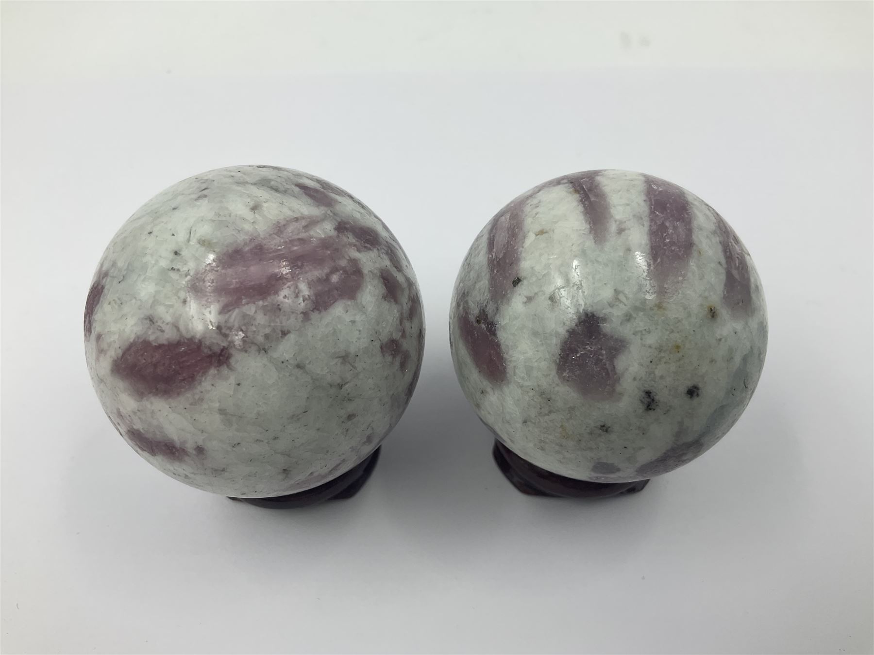Pair of pink tourmaline spheres, upon gilt metal stands, H9cm D5cm