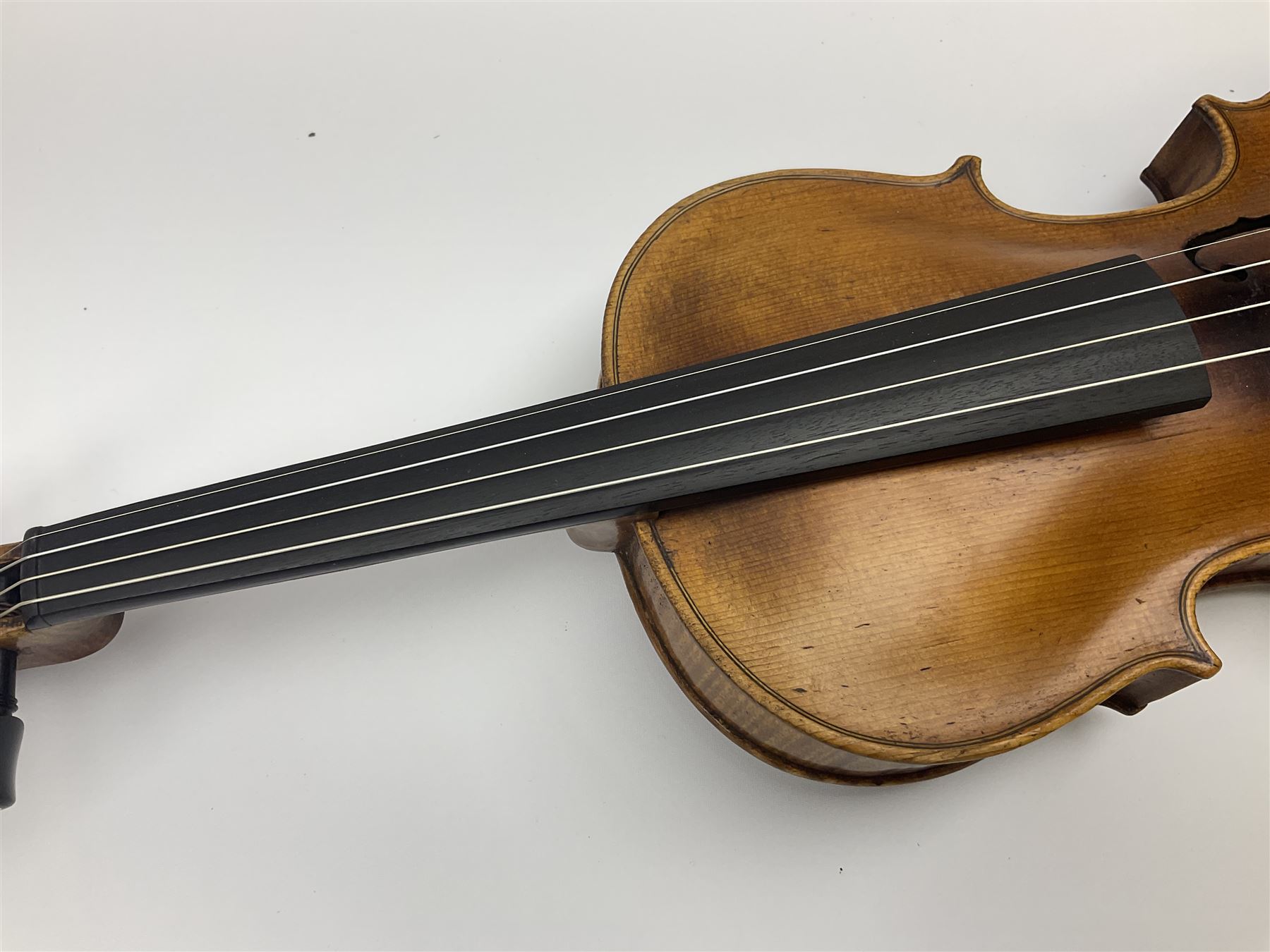 German Saxony violin c1900 with 35.5cm two-piece medium grain maple back and ribs and medium grain spruce top; bears label 'Jacobus Stainer in Absam prope Oenipontum 17xx Made in Germany', 59.5cm overall; with modern bow (2)