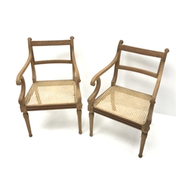 Pair cherry wood framed armchairs, shaped cresting rail, scrolling arms, cane work seat, tapering supports, W57cm