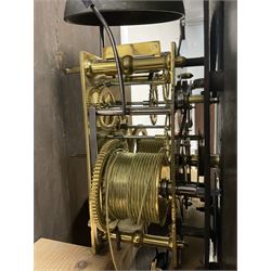 George Clapham of Brigg - Late 18th century 8-day oak cased longcase clock c1790 - flat topped hood with later carved addition, dog tooth moulding and blind fretwork beneath, break arch hood door flanked by reeded pilasters and capitals, trunk with canted corners and  door with a triple arched top, plinth with a later base with decoratively shaped feet, early painted dial with flowers enclosed in a gesso border to the spandrels, rolling moon to the arch, seconds dial and calendar aperture, Roman numerals and five minute Arabic's with makers name (indistinct), dial pinned via a false plate to a rack striking movement. With weights, key and pendulum.