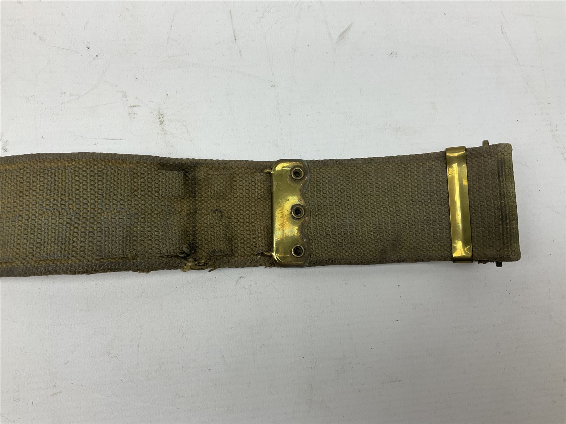 WW2 British black felt beret with Pioneer Corps cap badge, with Kangol Wear maker's mark dated 1943; and a British Army green webbing belt (2)