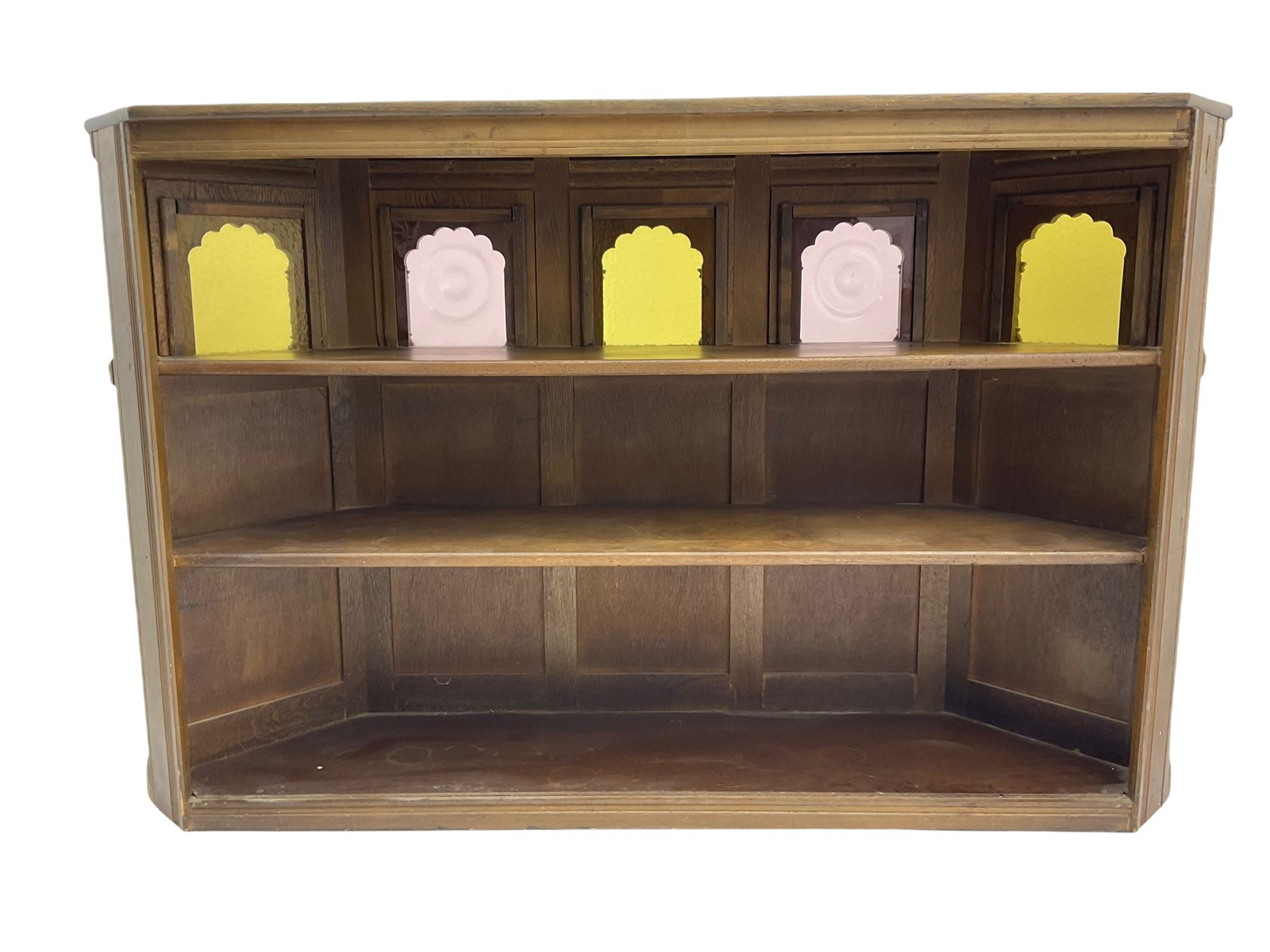 Old Charm - canted oak drinks bar, arched apertures set with mottled and bullseye colour glass panes, and three stools