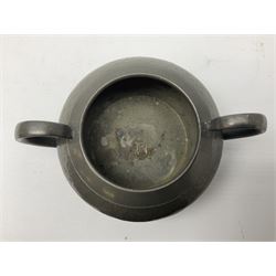 Liberty & Co Tudric pewter three piece tea service, comprising teapot with woven reed handle, twin handled open sucrier, and milk jug, each of squat form with planished finish, each impressed beneath Tudric Pewter Ware 01537 Made in England, together with a matched unmarked tray
