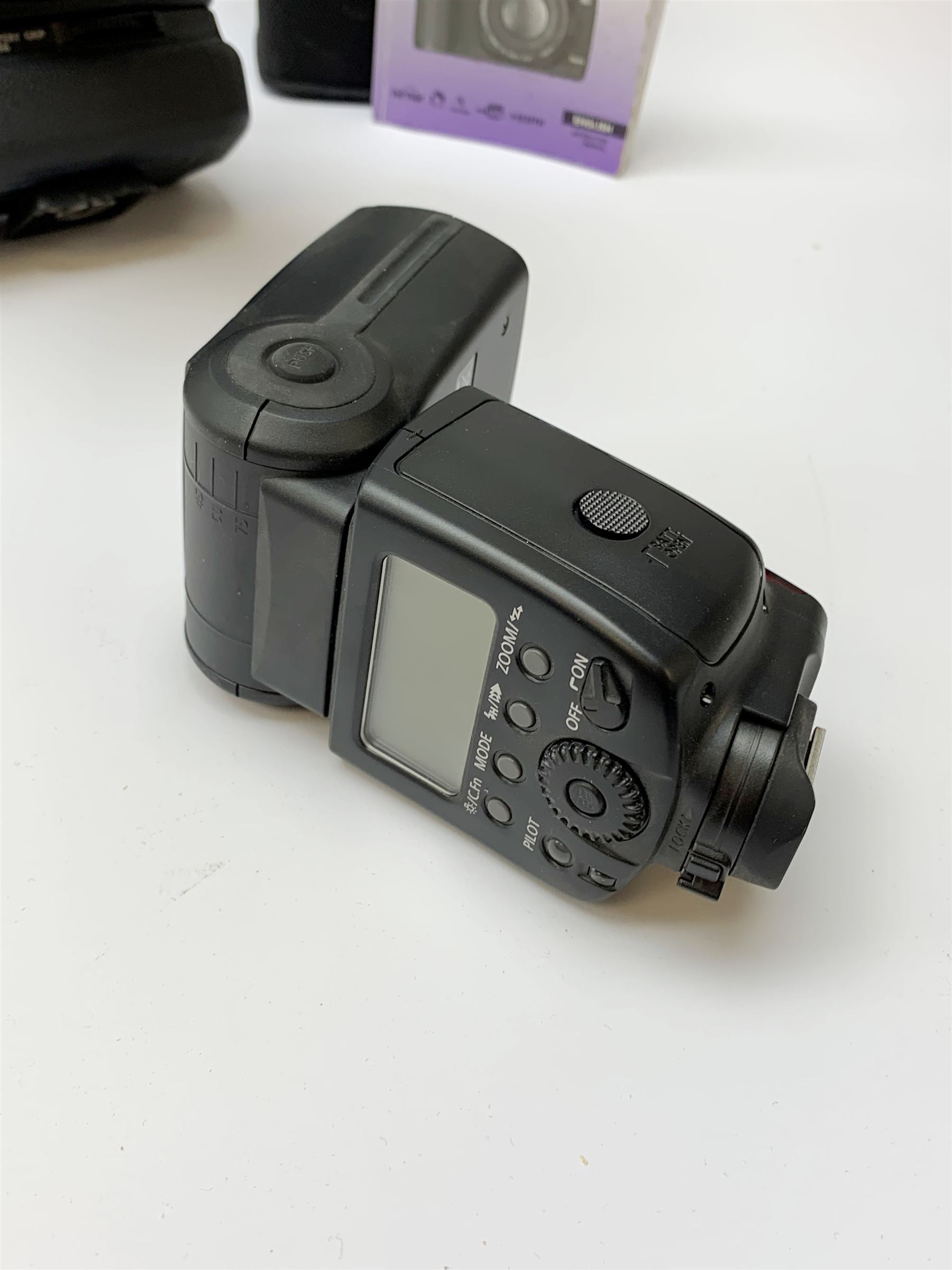 Canon EOS 5D camera body with Canon 'BG-E6' battery grip, Canon 'Speedlite 580EXII' flash and Canon lens 'Canon Zoom Lens EF 24-105mm 1:4 L IS USM' with Canon EOS 5D Mark II instruction manual