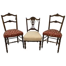 Pair of late 19th century walnut bedroom chairs, scrolled cresting rail carved with foliage, upholstered seats, on turned supports united by turned stretchers (W44cm); late Victorian bedroom chair with carved and pierced splat (3)
