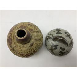 Janet Leach (American, 1918-1997) for Leach Pottery; speckled studio pottery vase of shouldered ovoid form with speckled brown decoration and trailing green and brown glaze upon beige and brown ground, with impressed J.L. monogram and Leach Pottery mark beneath, together with a Jeremy Leach blue speckled lidded circular dish with loop handle, impressed J.L, tallest H11cm