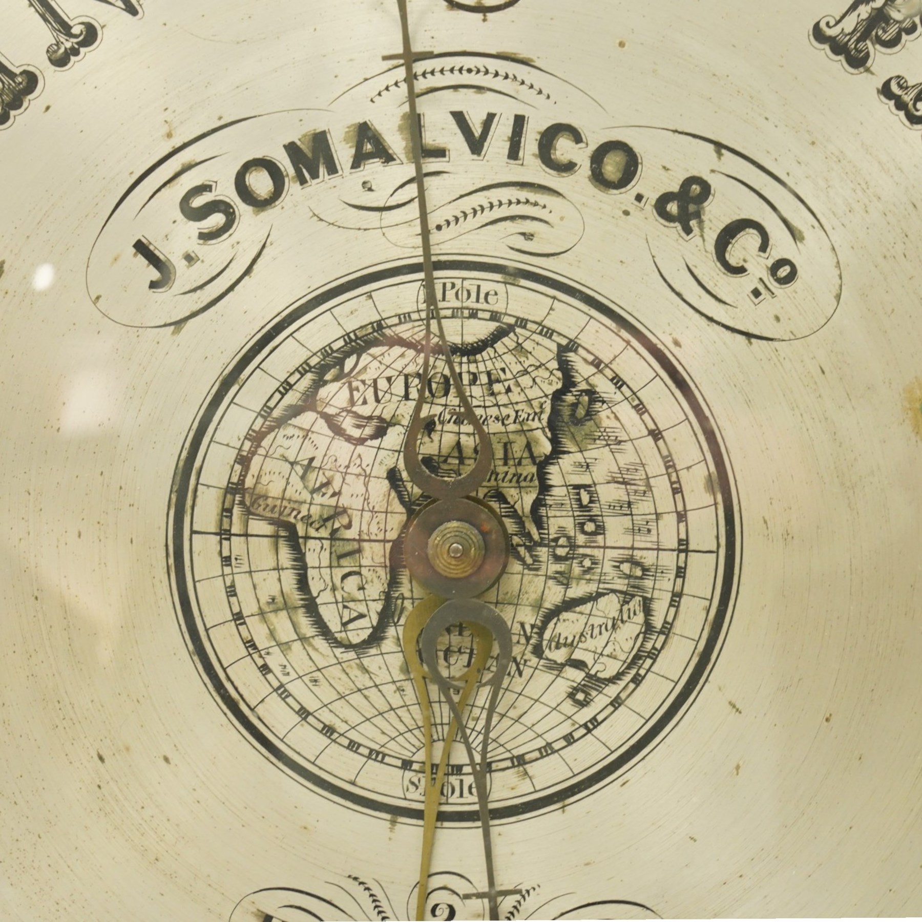J. Somalvico & Co., Hatton Garden, London - early 19th century rosewood wheel barometer, the shaped banjo-form case inlaid in mother-of-pearl with foliate and animal motifs, incorporating a mercury thermometer above the circular silvered dial with weather indications, globe motif and brass bezel, signed 'J. Somalvico & Co.'