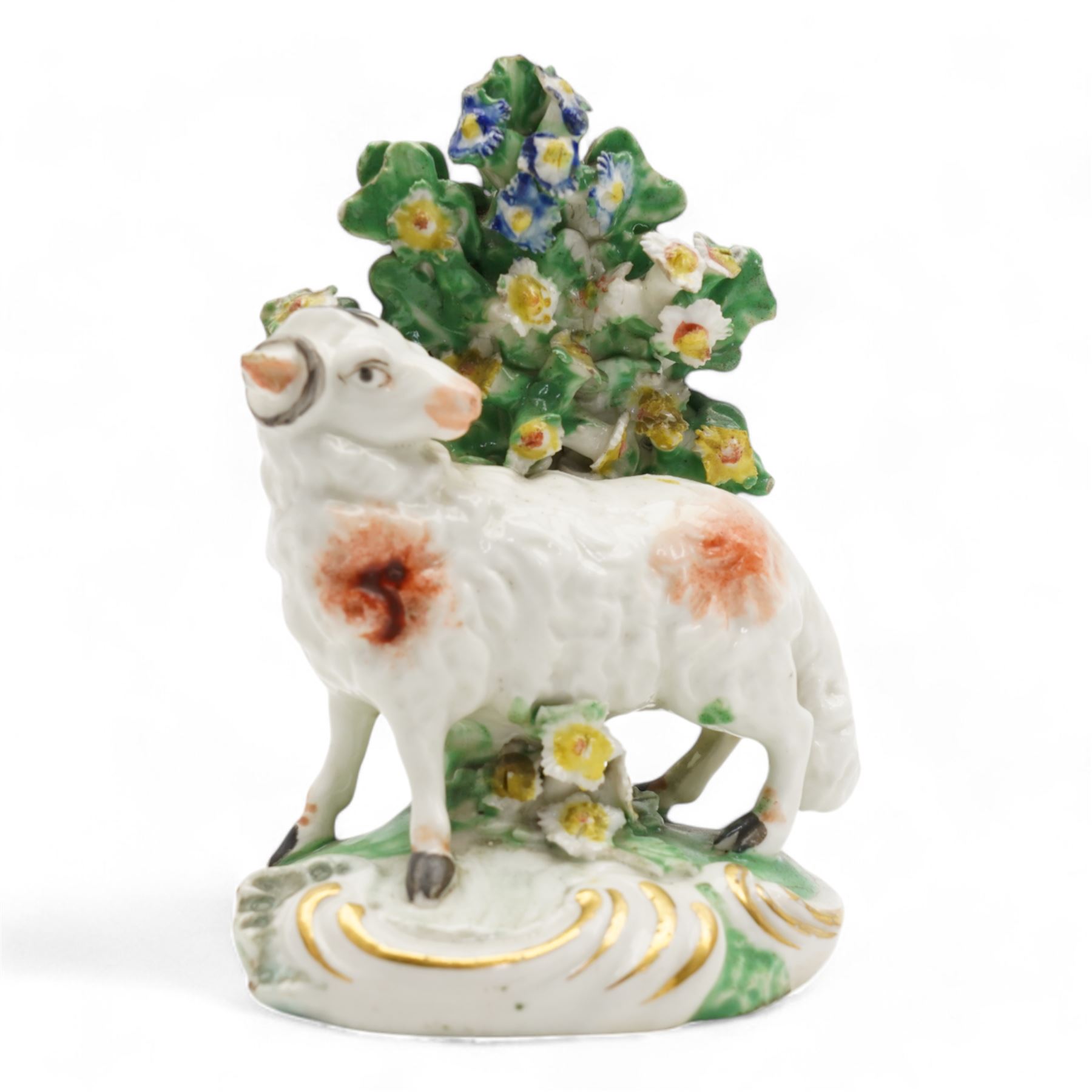 Two 18th century Derby porcelain groups modelled as a ram standing before bocage above a recumbent lamb, upon flower encrusted base, H15cm and two further Derby figures modelled as a ram and cow and calf (3)