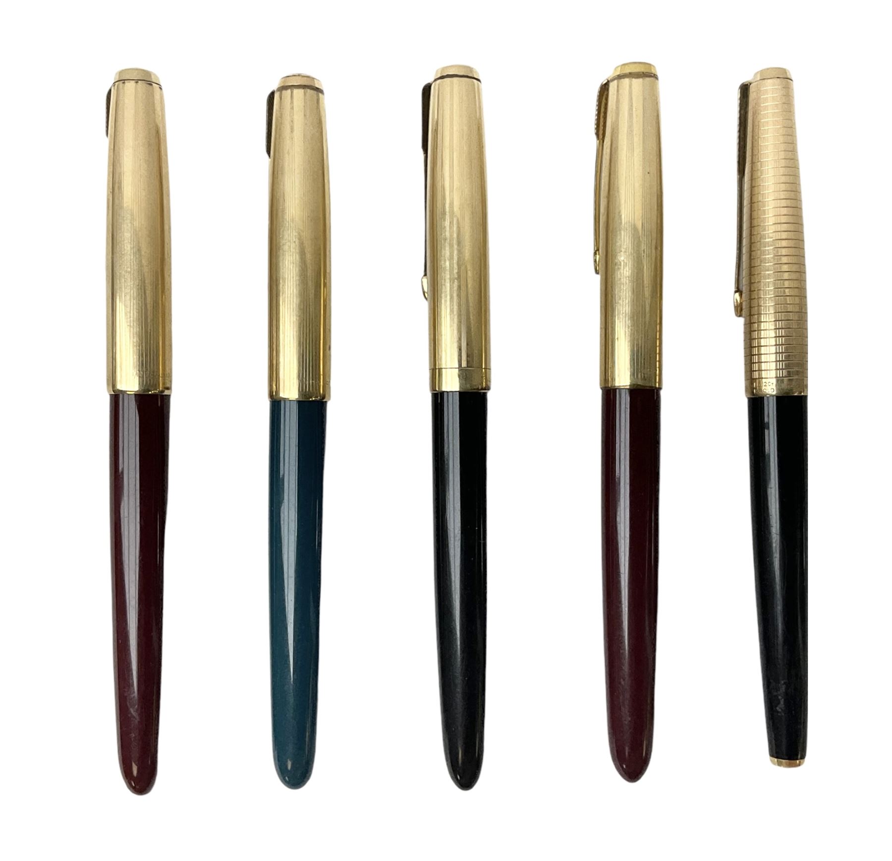 Five Parker fountain pens with gold caps, to include 65 Consort Insignia with rolled cross hatch gold cap, two Parker 51 fountain pens in burgundy with 12ct rolled gold caps, together with two further 51 examples in blue and black, all with stamped lids