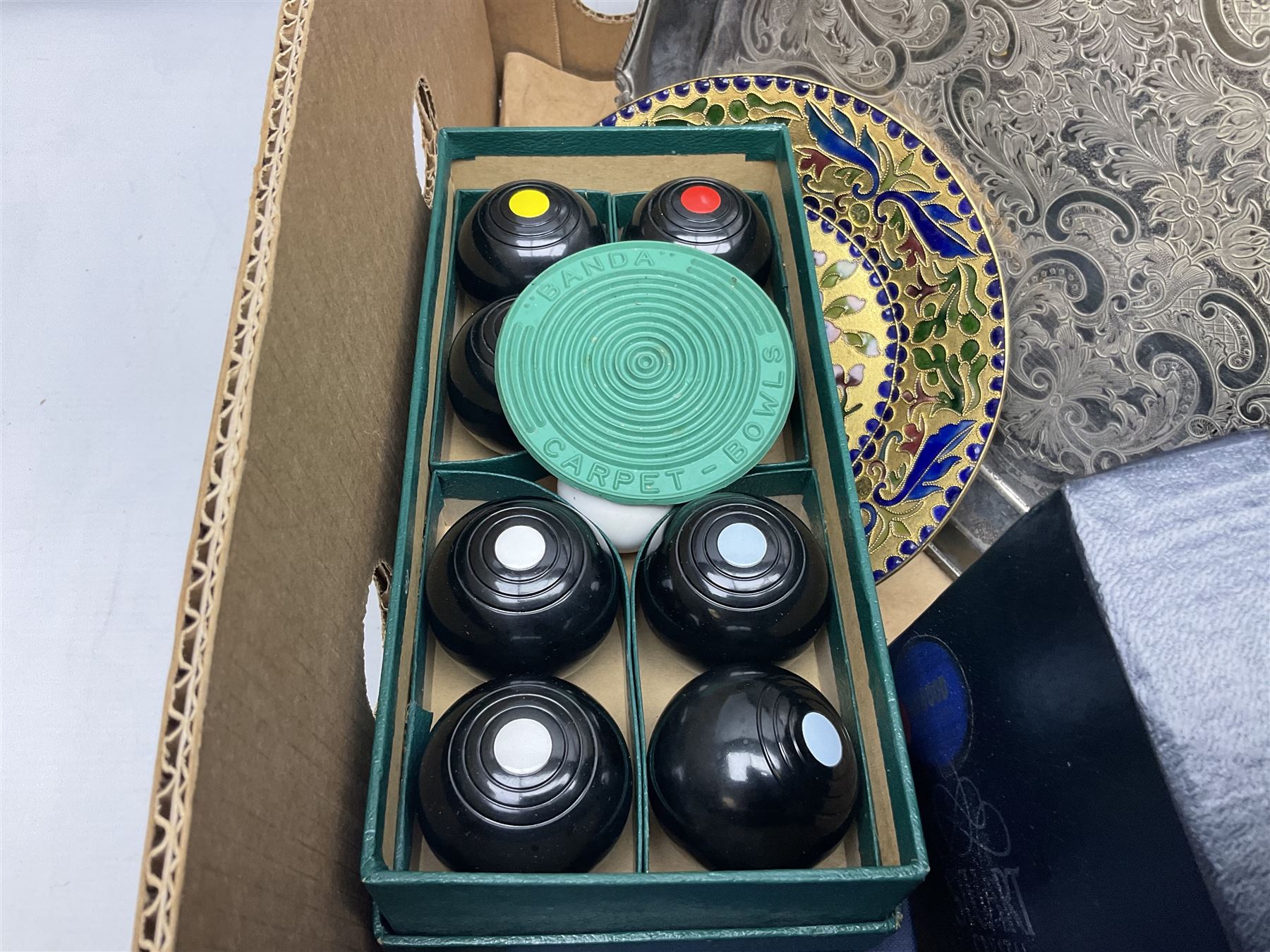 Boxed set of Banda carpet bowls, two boxed sets of Stuart glasses, Murano art glass bowl, cloisonné plate decorated with flowers upon gilt ground, silver plate and other metalware etc