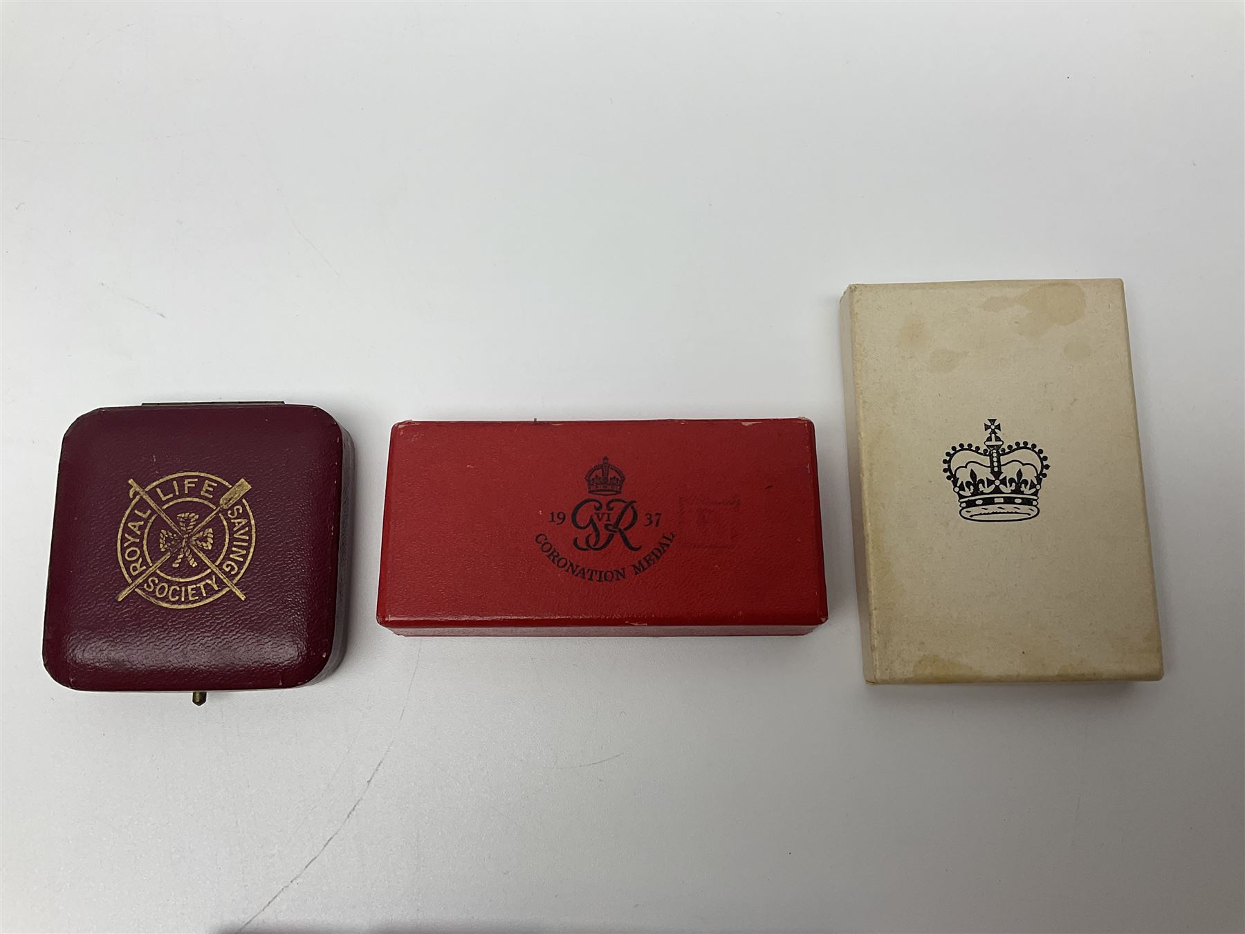 Collection of WW2 and police medals c.1933-1955, awarded to Eric Drinkwater comprising 1939-45 War Medal, Defence Medal, 1939-45 Star and Burma Star, on wearing bar; 1918-62 General Service Medal with Cyprus clasp to P.S. E.G. Drinkwater; boxed; Police Long Service and Good Conduct Medal to Const. Eric C. Drinkwater; cased; Royal Life Saving Society bronze medal to E.C. Drinkwater July 1933; boxed; and George V 1937 coronation medallion; boxed.