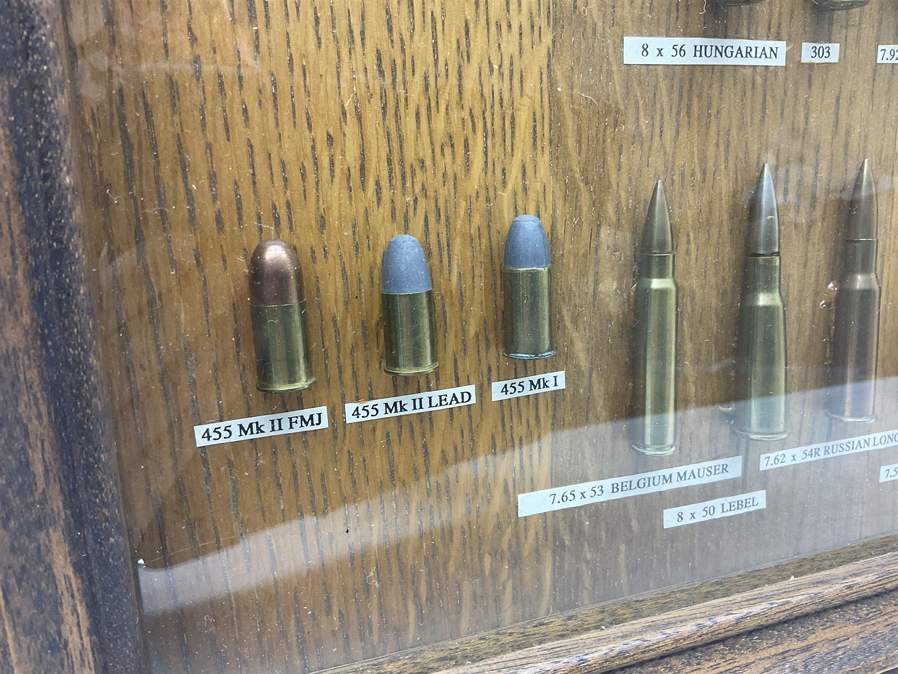 SECTION 1 FIRE-ARMS CERTIFICATE REQUIRED - Two cased specimen displays of annotated ammunition/cartridges - one entitled 'First World War Collection' containing twenty items including 7.63 Mauser, 7.65 Luger, .303, 7.62 x 54R Russian long, 455 Mk.II lead, 455 Auto etc; the other with sixteen items/clips including Musket cartridge, .577 Snider-Enfield, .577/45 Martini Henry, .303 Enfield Magazine, 7.62 Charger Clip, Specialised .303 rounds etc; largest case 41 x 76cm (2)