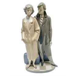 Lladro figure, Sad Parting, modelled as a man and woman with suitcases, sculpted by Francisco Catalá, with original box, no 5583, year issued 1989, year retired 1991, H33cm