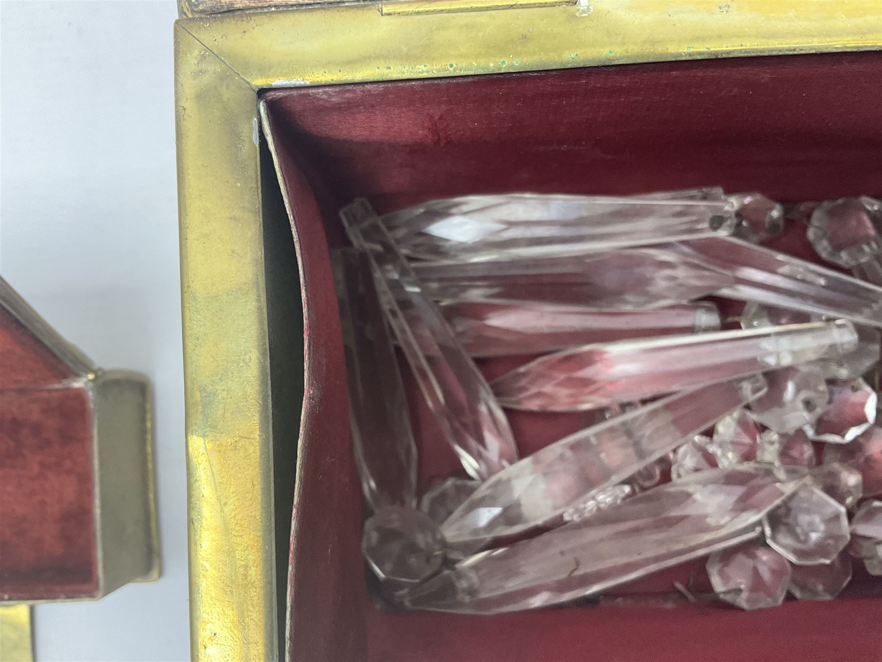 Collection of victorian and later brass desk accessories, to include a letter holder with cherub design, ink well of square form with hinged lid, brass table bell, brass casket with relief decoration, etc  