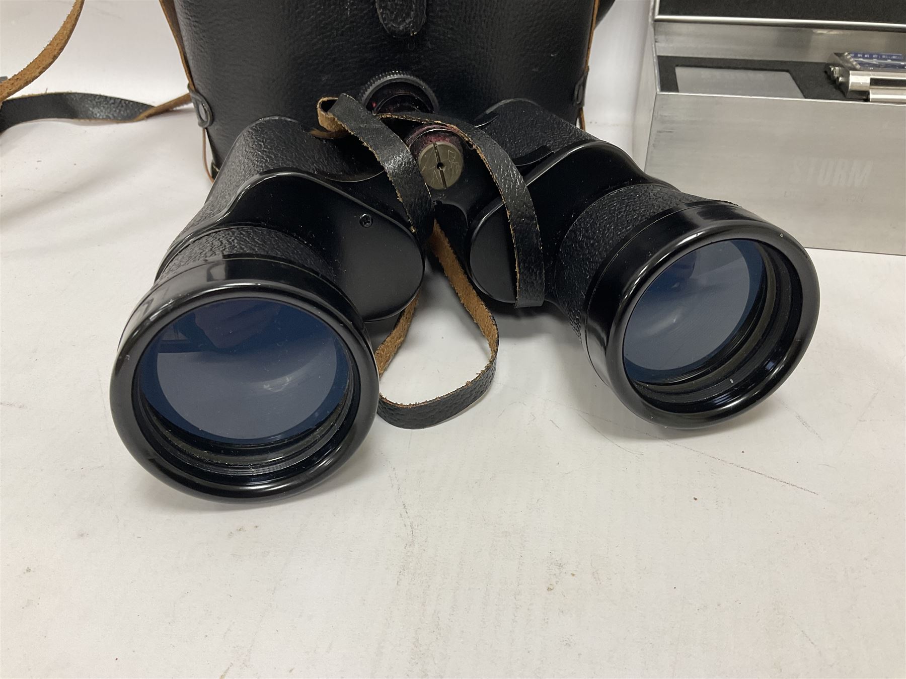 Pair of Regent 10x50 binoculars in case, together with a Storm Lexo Chronograph wristwatch
