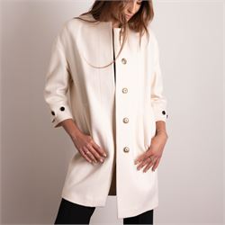 Burberry London - wool coat in cream, with concealed front popper fastening, bracelet-length sleeves with tab and black button detail and side slip pockets, with slit to back, size 40, unused with original Harvey Nichols garment bag and hanger