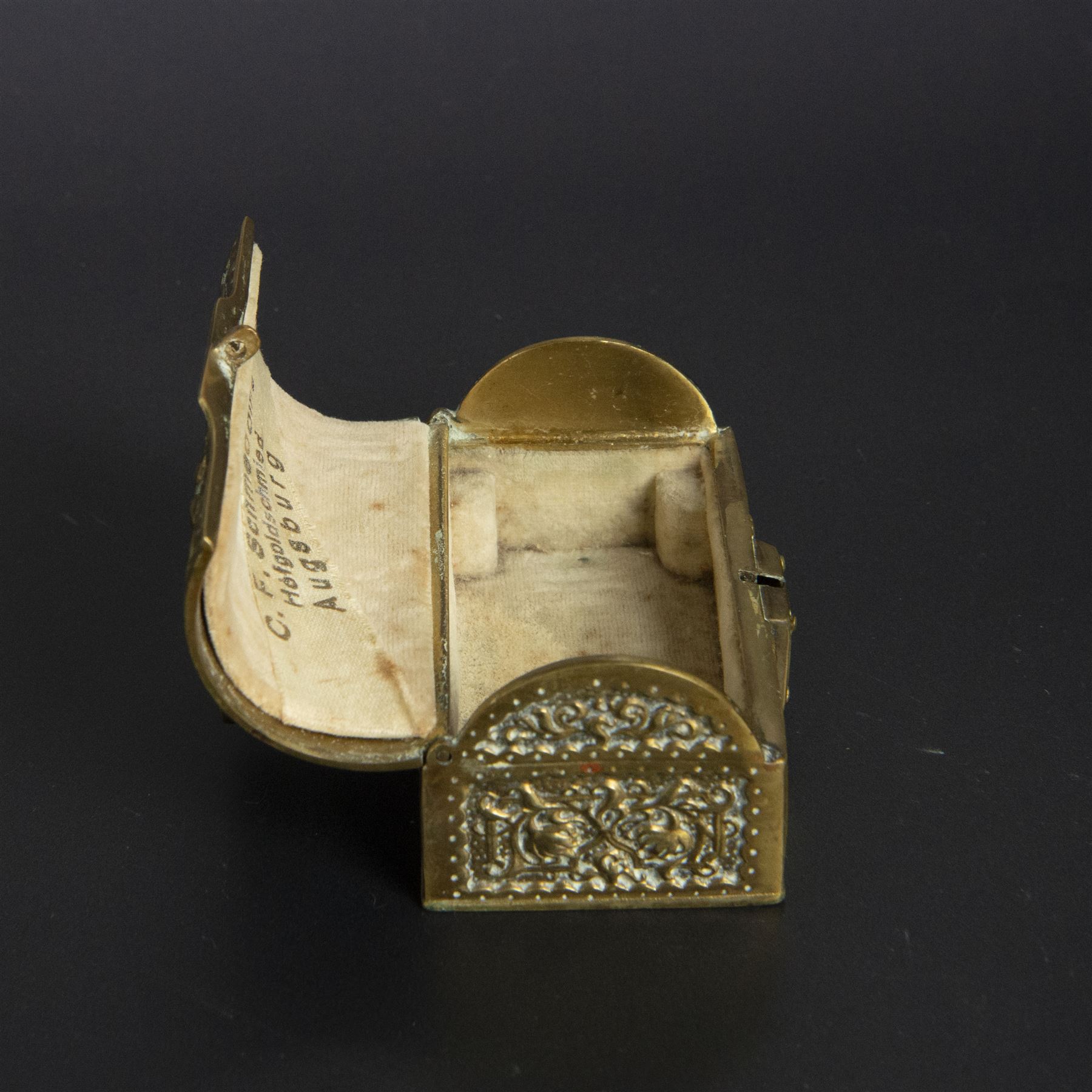 Gilt bronze mounted black glass seal, contained within a brass casket, with velvet interior and inner label reading 'C. F. Schmedding Augsburg', together with a porcelain handled seal decorated with floral sprays on a pink ground