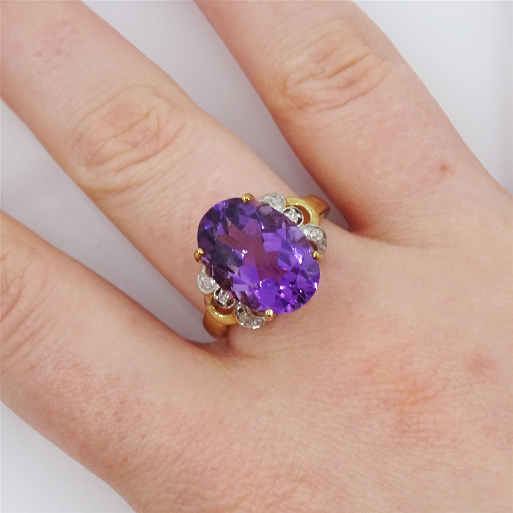 9ct gold single stone oval cut amethyst ring, with openwork diamond set shoulders, hallmarked