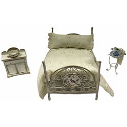 Georgian style wooden double fronted three-storey dolls house with pale blue stucco finish under a faux tiled roof with two chimney stacks, the double hinged front opening to reveal six fully decorated rooms with floor coverings, central staircase, porcelain fitted bathroom, kitchen with deep white sink and Aga cooker, electric lighting with adaptor, fully furnished with French style and other furniture, grand piano etc, and comprehensive range of accessories H82cm W61cm D31cm