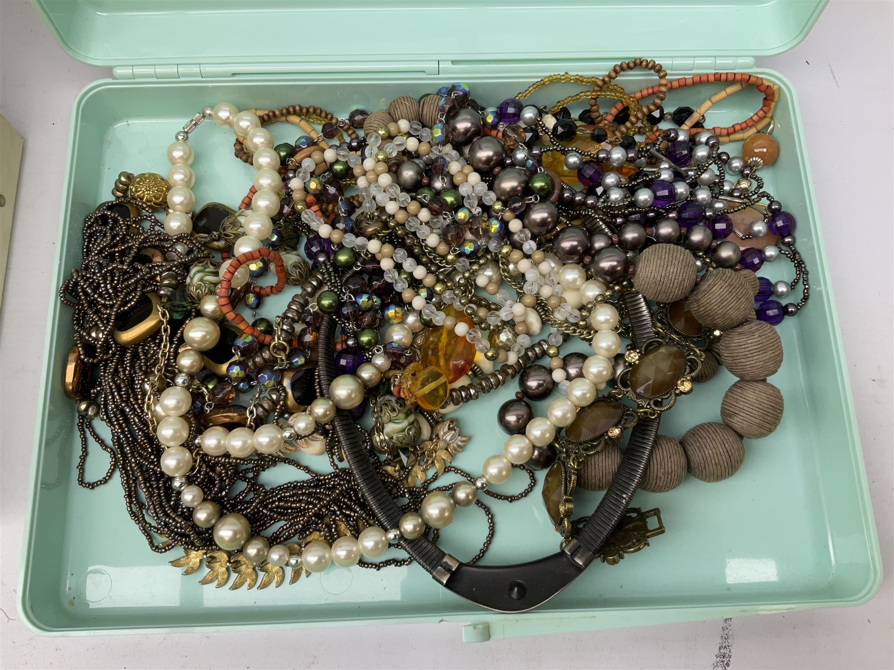Collection of costume jewellery including enamel and marcasite flower brooch, two V Villani Italy bangles, clip on earrings, brooches, bangles, beaded necklaces and a Skagen wristwatch