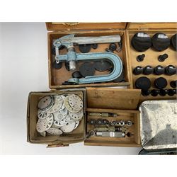A selection of dismantled watch parts and tools, components, dials, screwdrivers, watch mainspring winder etc