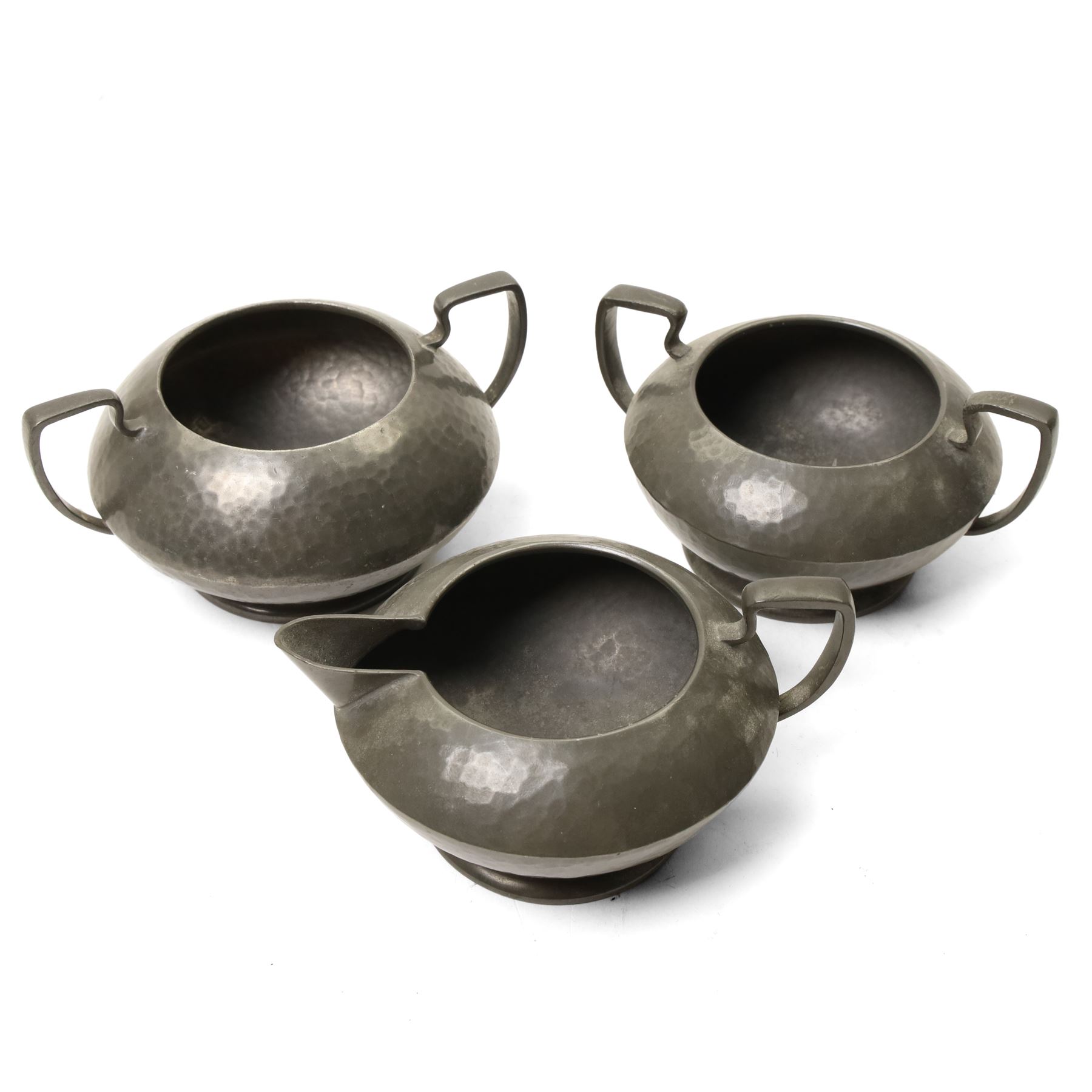 Quantity of Tudric pewter including small hammered pedestal bowl, milk jugs, sugar bowls etc and a WMF dish with Dutch figures No261