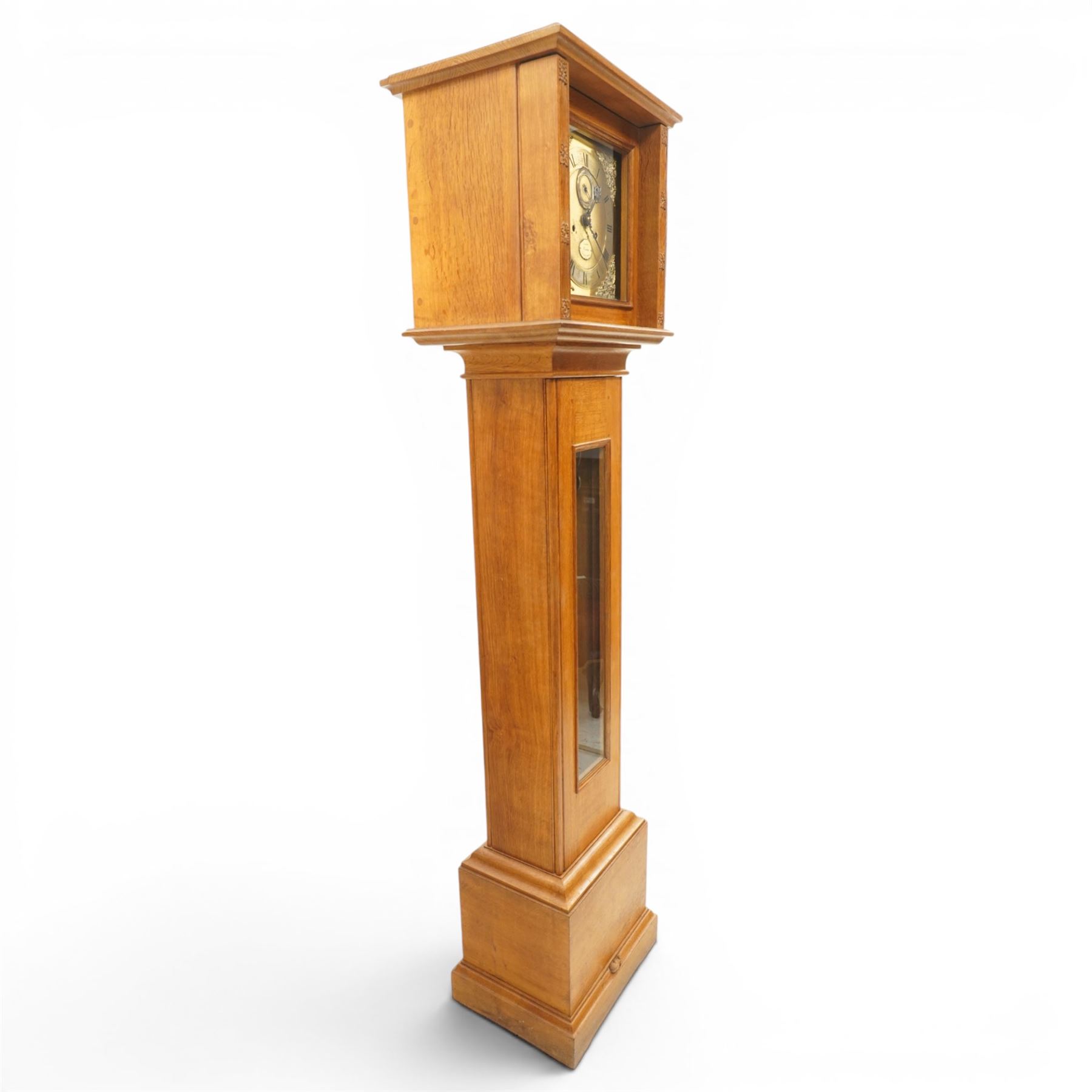 Mouseman - mid-20th century oak longcase clock, with a high quality weight driven movement and dial by Sinclair and Harding & Co of Cheltenham, the rectangular hood carved with foliate ornament, over a glazed and oak trunk on stepped base, with carved mouse signature, by the workshop of Robert Thompson of Kilburn Provenance: purchased directly from the Kilburn workshop in the 1940s/1950s