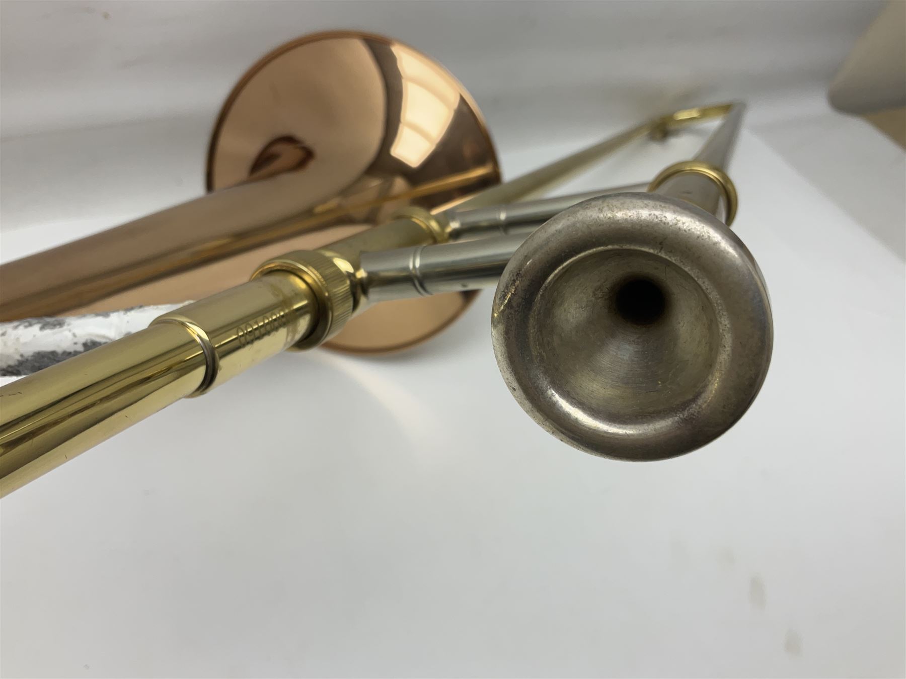 Sebastian Bucklet Aquae Sulis copper and brass trombone No.0910004; in lightweight carrying case; and Kinsman folding tubular chrome music stand in case (2)