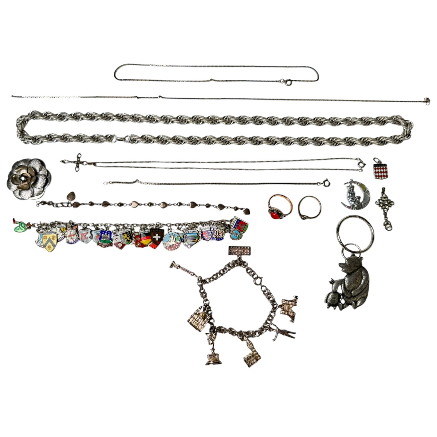 9ct gold stone set ring and silver enamel town badge charm bracelet, cross pendant, ring and heart link bracelet, and a collection of costume jewellery