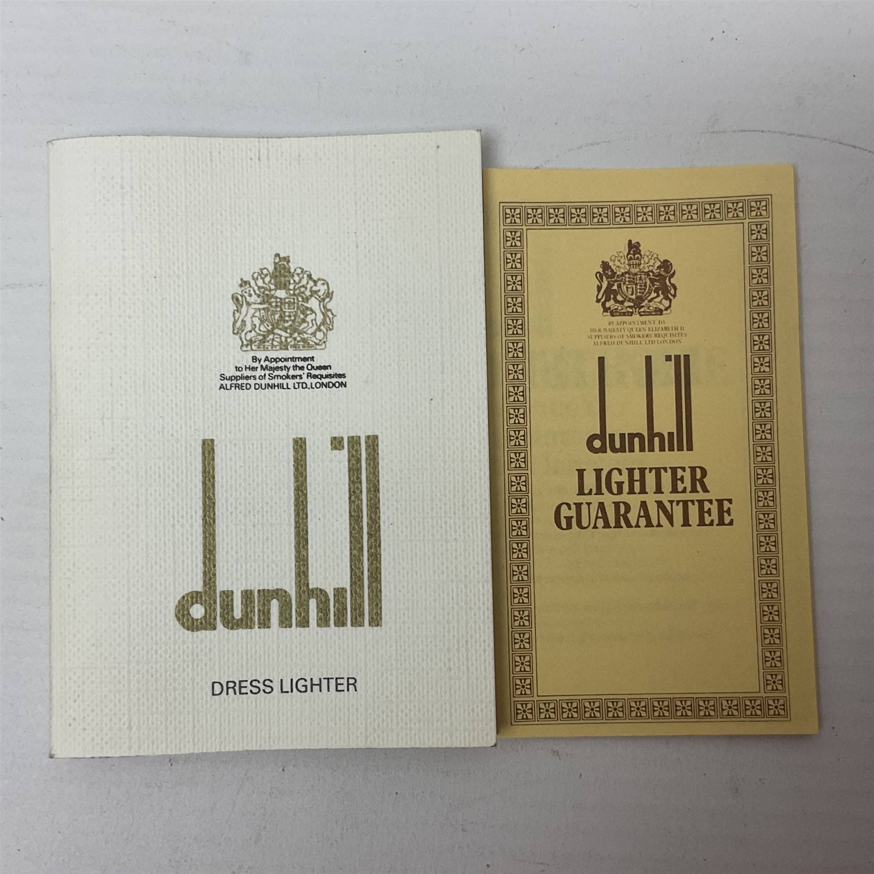 Dunhill gold plated dress lighter, in original fitted case with paperwork, together with a Dunhill rolagas lighter