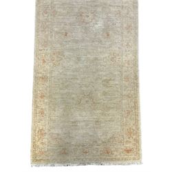 Persian Zeigler runner, ivory ground decorated with faint floral design 
