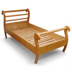 Unicornman - pair of craftsman-made oak single beds, of sleigh shape with scrolled head and foot-boards with octagonal stretchers, slatted base, raised on inward-splayed squared supports, applied with carved unicorn signature, by Geoff Gell of Coxwold
