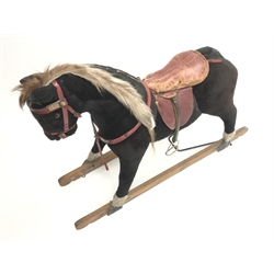  Early 20th century plush covered rocking horse, saddle and stirrups, no trestle base, L135cm  