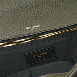 Yves Saint Laurent Calypso large shoulder bag, grey grained leather with envelope flap and gold-tone Cassandre monogram, sliding chain and leather shoulder strap, magnetic fastening, interior lined in black textile with zip pocket and leather brand tab stamped Saint Laurent Paris, made in Italy, together with original Saint Laurent dust bag, W37cm D10cm H22cm