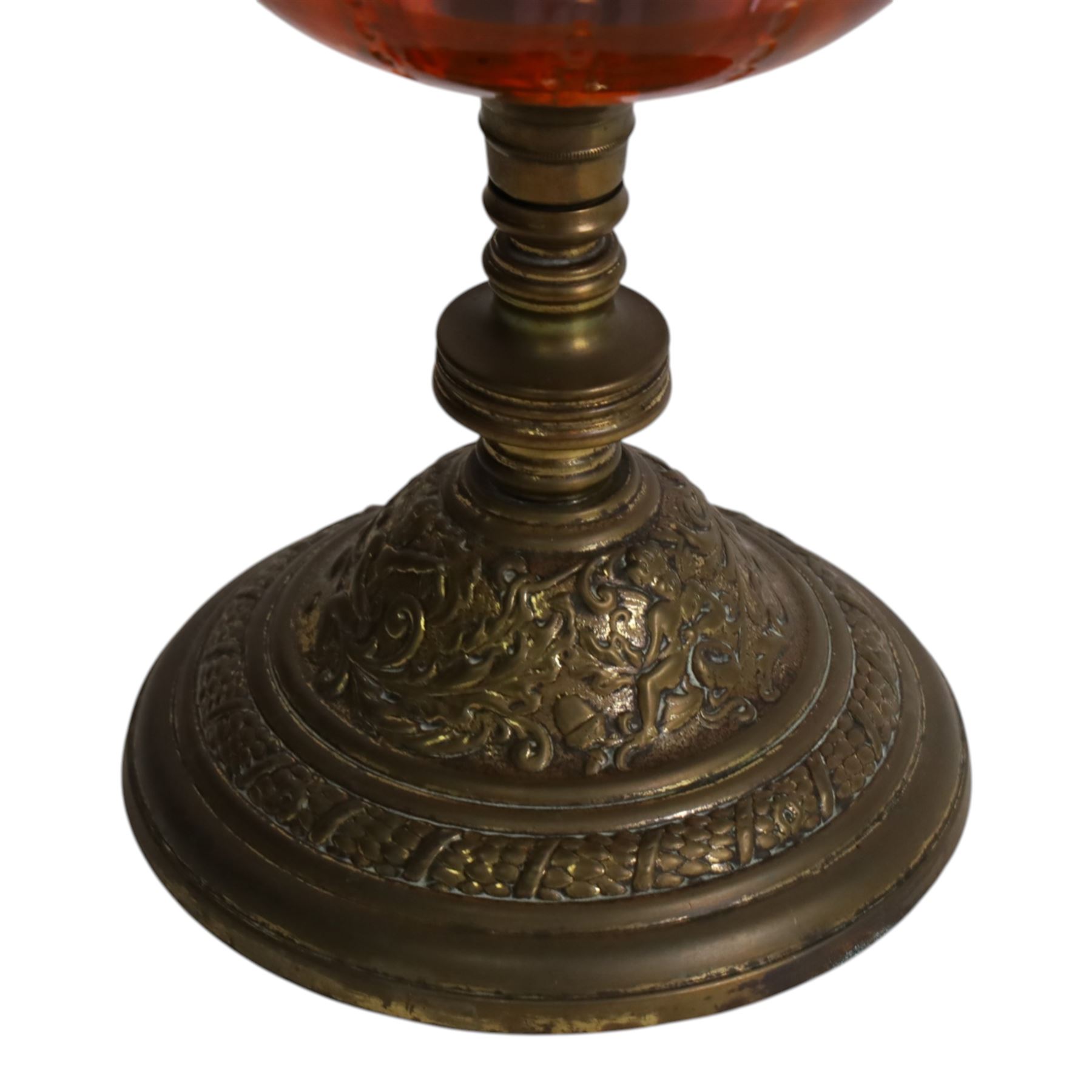 Victorian oil lamp, the brass base supporting cranberry glass reservoir, with clear glass chimney and cranberry shade with fluted rim, overall H59cm