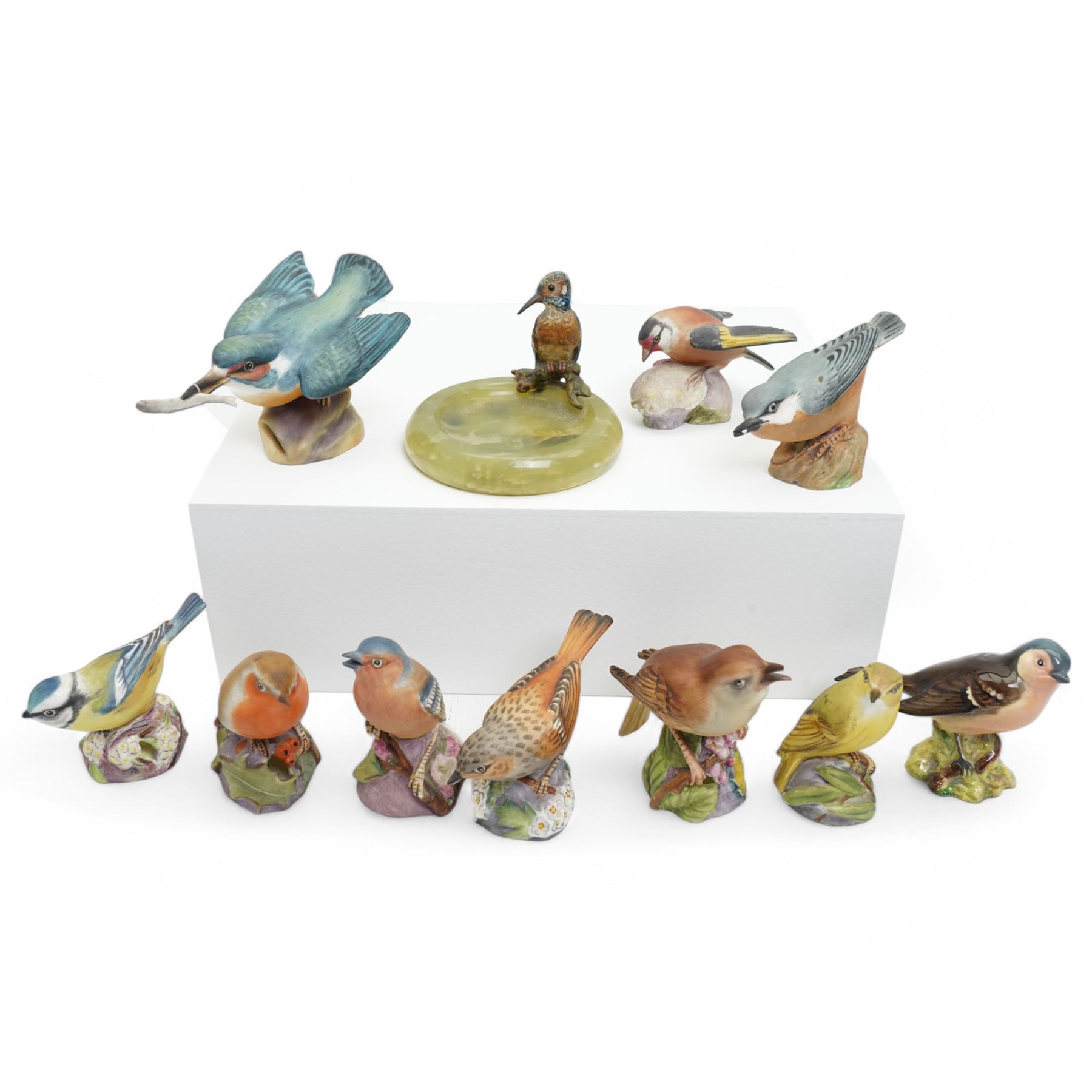 Collection of bird figures, to include various Beswick and Royal Worcester examples, comprising 'Wood Warbler' 'Nuthatch' 'Robin' 'Blue Tit' etc, together with an onyx dish with cold painted bronze Kingfisher (11)
