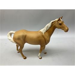 Collection of Beswick horses, including grey horse no.701, palomino foal no 836, grey stocky jogging mare no.855 etc, together two Royal Doulton horses, (8)